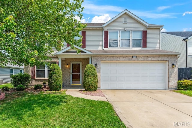 608 Falling Leaf Way, Mascoutah, IL 62258 - view of front facade featuring driveway, an attached garage, a front yard, and brick siding