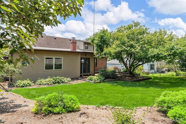 914 Trelane Ave, Crestwood, MO 63126 - back of property featuring a lawn and a chimney