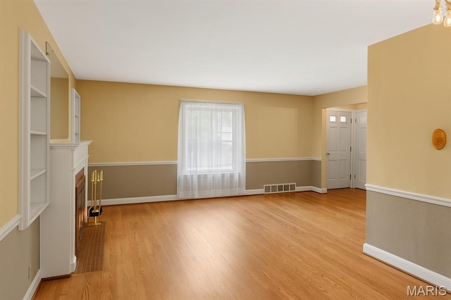 914 Trelane Ave, Crestwood, MO 63126 - unfurnished living room featuring light wood finished floors and a fireplace
