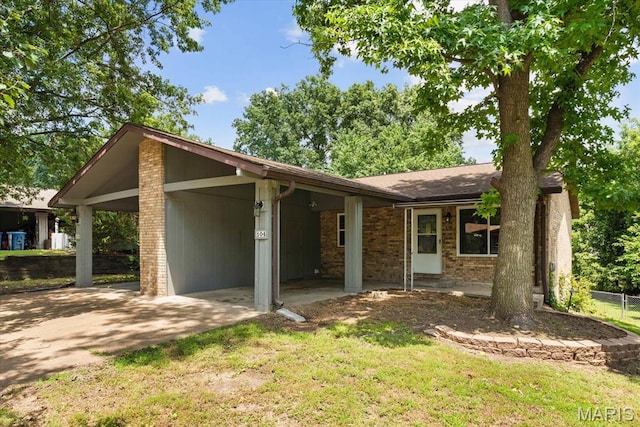 104 Britanna Dr, Swansea, IL 62226 - view of front of house with a carport, brick siding, and concrete driveway