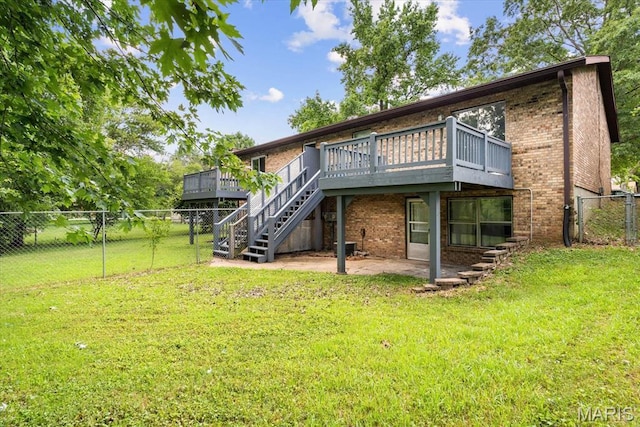 104 Britanna Dr, Swansea, IL 62226 - rear view of house featuring a wooden deck, brick siding, stairway, and a gate