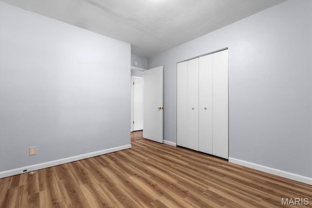 104 Britanna Dr, Swansea, IL 62226 - unfurnished bedroom featuring wood finished floors and a closet