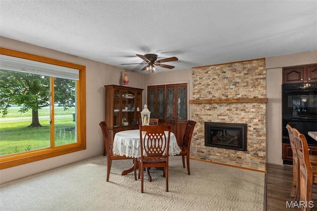 900 Montana St, Gillespie, IL 62033 - dining area featuring a ceiling fan and a fireplace