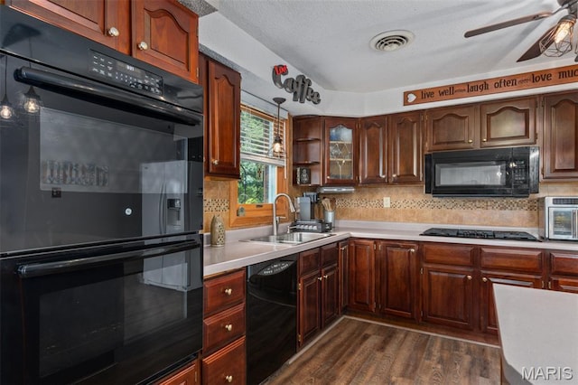 900 Montana St, Gillespie, IL 62033 - kitchen featuring black appliances, ceiling fan, light countertops, dark wood-type flooring, and backsplash