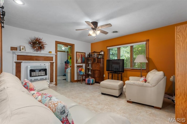 900 Montana St, Gillespie, IL 62033 - living room with heating unit, ceiling fan, and a glass covered fireplace