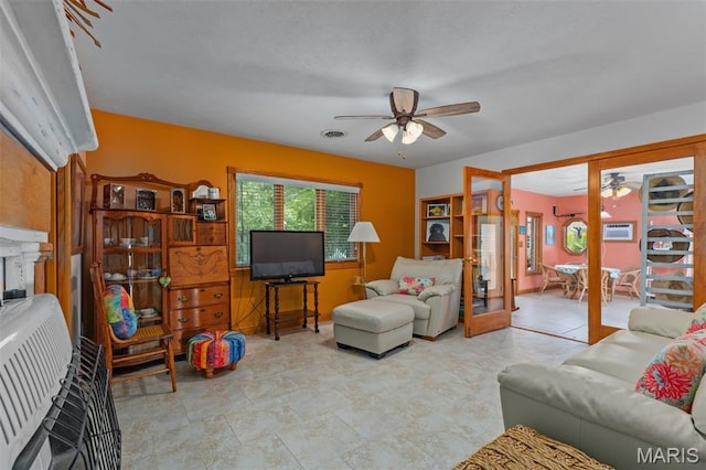 900 Montana St, Gillespie, IL 62033 - living area with a ceiling fan, heating unit, and a wall mounted AC