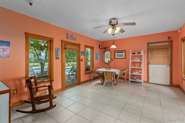 900 Montana St, Gillespie, IL 62033 - dining area with a wall mounted air conditioner, ceiling fan, and light tile patterned floors