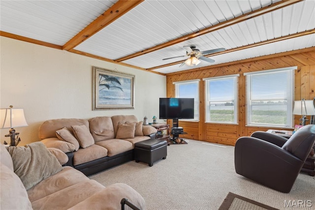 614 Main St, Keyesport, IL 62253 - carpeted living room featuring beam ceiling, ceiling fan, and wooden walls
