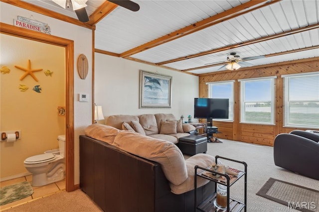 614 Main St, Keyesport, IL 62253 - living room with ceiling fan, light colored carpet, beamed ceiling, and wood walls