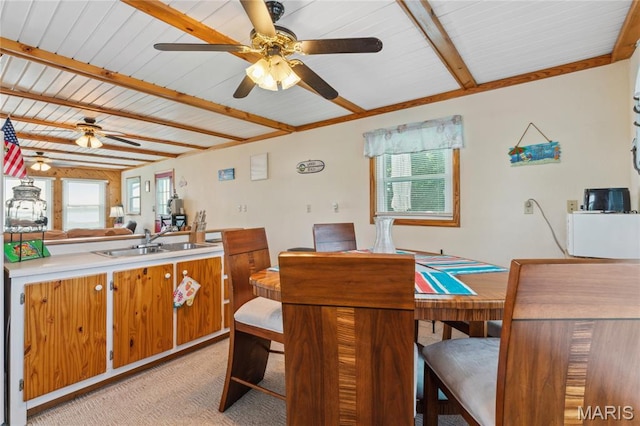 614 Main St, Keyesport, IL 62253 - dining room featuring ceiling fan, healthy amount of natural light, beamed ceiling, and light carpet
