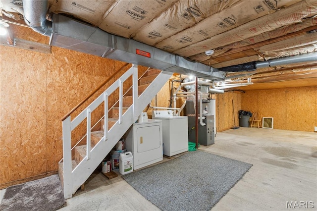 614 Main St, Keyesport, IL 62253 - unfinished basement featuring separate washer and dryer, stairs, and heating unit