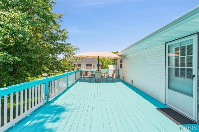 614 Main St, Keyesport, IL 62253 - wooden deck with outdoor dining area