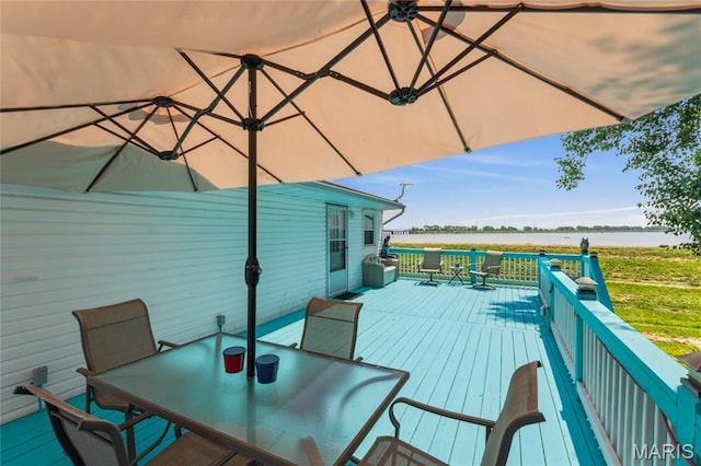 614 Main St, Keyesport, IL 62253 - wooden terrace with a water view and outdoor dining space