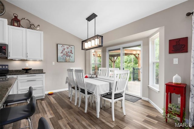 815 Mule Creek Dr, Wentzville, MO 63385 - dining area featuring dark wood-style flooring and lofted ceiling
