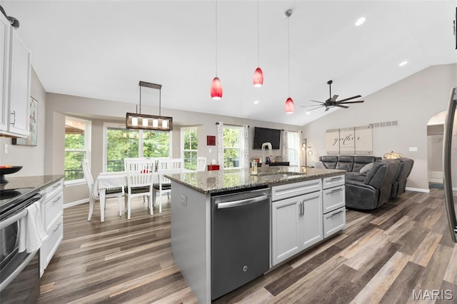 815 Mule Creek Dr, Wentzville, MO 63385 - kitchen featuring stainless steel appliances, vaulted ceiling, dark wood finished floors, ceiling fan, and stone counters