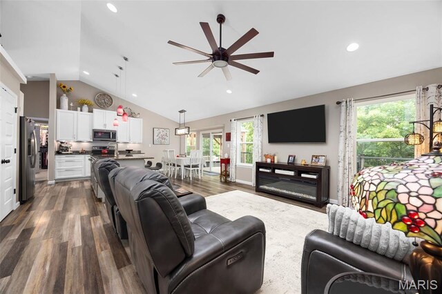 815 Mule Creek Dr, Wentzville, MO 63385 - living room with a ceiling fan, vaulted ceiling, dark wood-style flooring, healthy amount of natural light, and recessed lighting