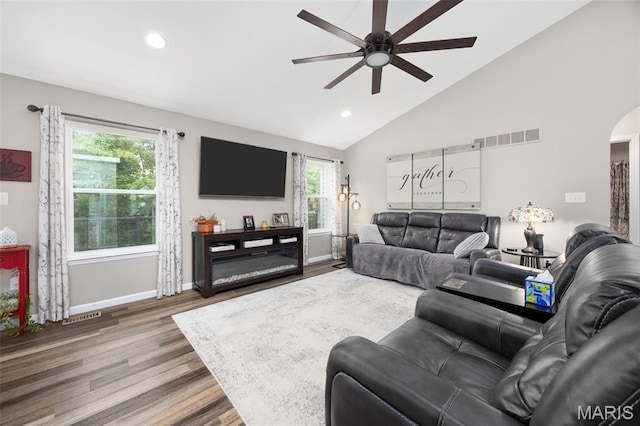 815 Mule Creek Dr, Wentzville, MO 63385 - living area featuring ceiling fan, lofted ceiling, wood finished floors, healthy amount of natural light, and arched walkways