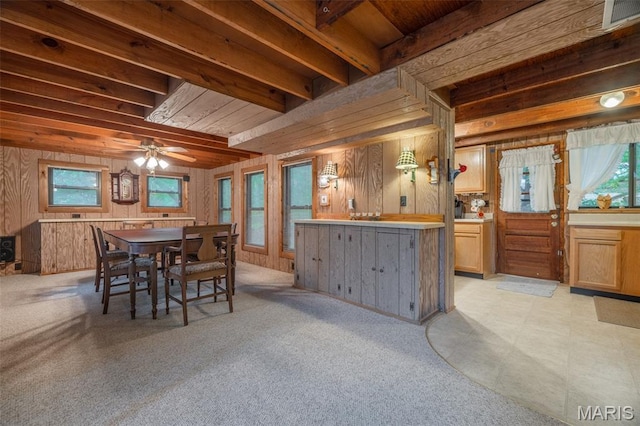 376 W Wanderfern Circle Dr, Innsbrook, MO 63390 - dining area with wooden walls, a ceiling fan, and beamed ceiling