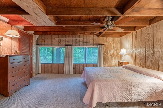 376 W Wanderfern Circle Dr, Innsbrook, MO 63390 - bedroom with wood ceiling with exposed beams, wood walls, multiple windows, carpet flooring, and a ceiling fan