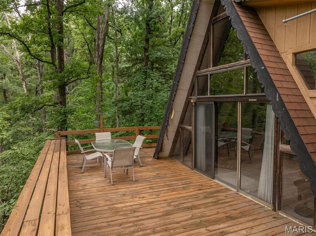 376 W Wanderfern Circle Dr, Innsbrook, MO 63390 - deck featuring outdoor dining space and a view of trees
