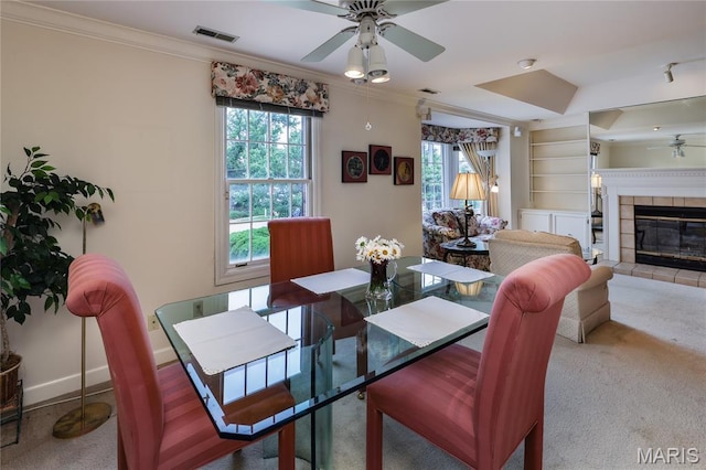 210 N Taylor Ave Unit C, Kirkwood, MO 63122 - dining room featuring a ceiling fan, ornamental molding, healthy amount of natural light, built in features, and carpet