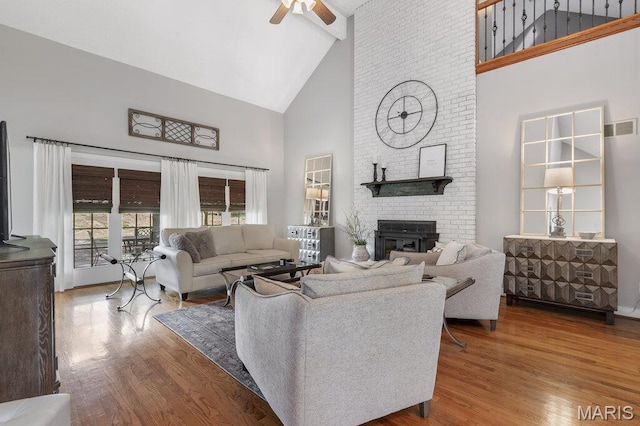 108 Lucys Lndg, Waterloo, IL 62298 - living area featuring high vaulted ceiling, wood finished floors, a fireplace, a ceiling fan, and beam ceiling