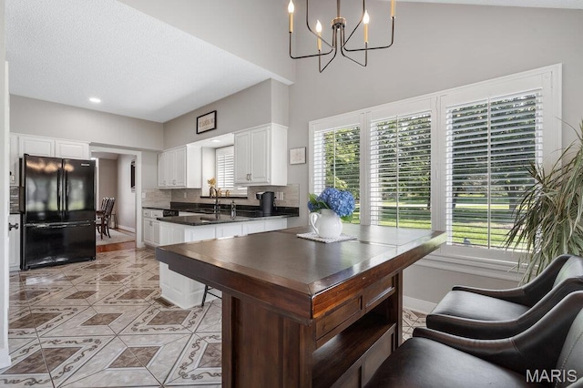 108 Lucys Lndg, Waterloo, IL 62298 - office space with light tile patterned floors, a chandelier, and a high ceiling