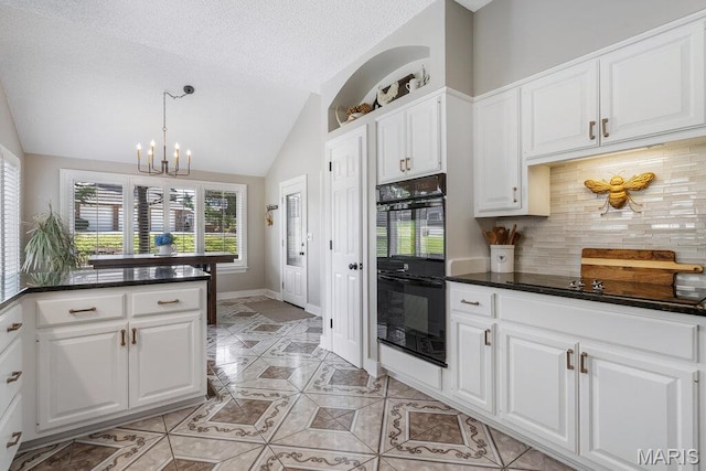 108 Lucys Lndg, Waterloo, IL 62298 - kitchen with black appliances, light tile patterned flooring, vaulted ceiling, a chandelier, and tasteful backsplash