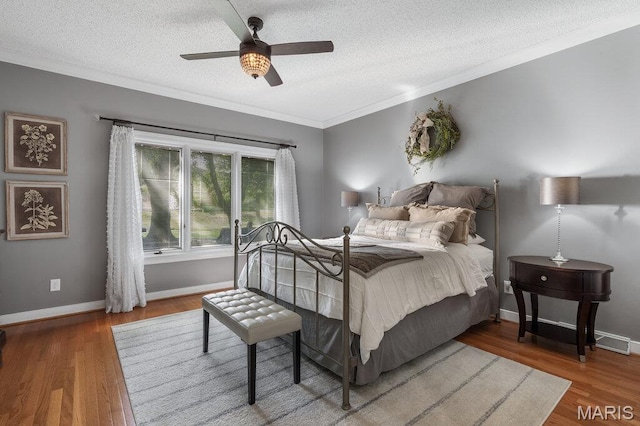 108 Lucys Lndg, Waterloo, IL 62298 - bedroom featuring a textured ceiling, crown molding, wood finished floors, and a ceiling fan