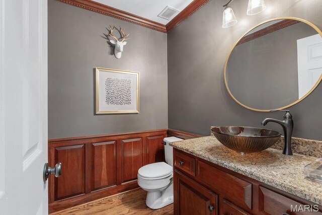 108 Lucys Lndg, Waterloo, IL 62298 - bathroom featuring vanity, crown molding, wood finished floors, wainscoting, and a decorative wall