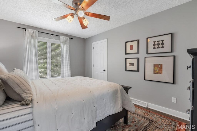 108 Lucys Lndg, Waterloo, IL 62298 - bedroom with a textured ceiling, wood finished floors, and a ceiling fan