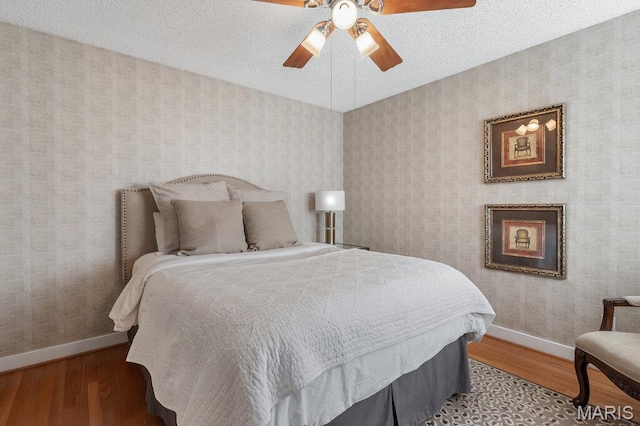108 Lucys Lndg, Waterloo, IL 62298 - bedroom featuring wallpapered walls, wood finished floors, and a ceiling fan