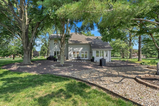 108 Lucys Lndg, Waterloo, IL 62298 - back of house featuring a patio area, a yard, and a shingled roof