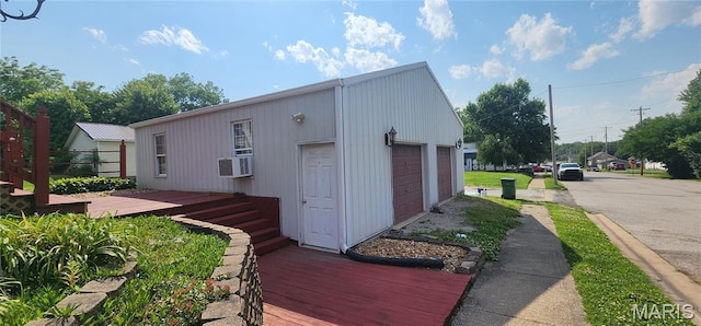 1629 Swanwick St, Chester, IL 62233 - view of front of home with a detached garage, cooling unit, and a wooden deck