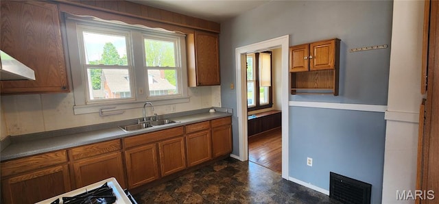 1629 Swanwick St, Chester, IL 62233 - kitchen featuring a sink, brown cabinetry, and baseboards