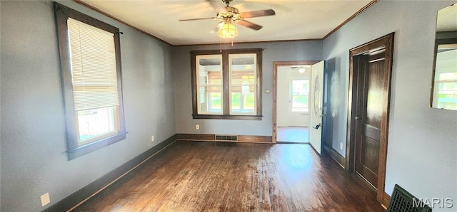 1629 Swanwick St, Chester, IL 62233 - spare room with dark wood-style flooring, ornamental molding, plenty of natural light, ceiling fan, and baseboards
