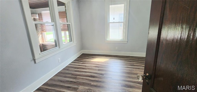1629 Swanwick St, Chester, IL 62233 - spare room featuring baseboards and dark wood-style floors