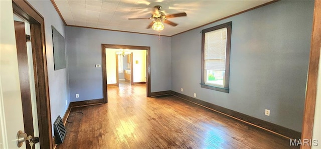 1629 Swanwick St, Chester, IL 62233 - empty room with ornamental molding, wood finished floors, a ceiling fan, baseboards, and a chandelier