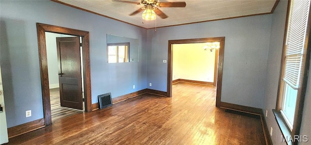 1629 Swanwick St, Chester, IL 62233 - spare room with ornamental molding, wood finished floors, baseboards, ceiling fan, and a chandelier