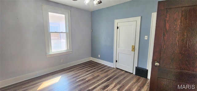1629 Swanwick St, Chester, IL 62233 - unfurnished bedroom with dark wood-style floors and baseboards