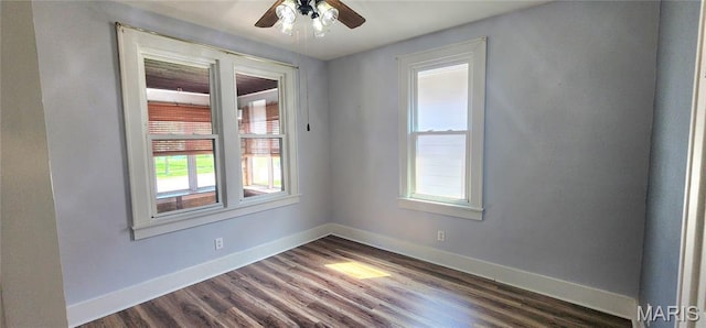 1629 Swanwick St, Chester, IL 62233 - empty room featuring dark wood-style flooring, baseboards, and a ceiling fan