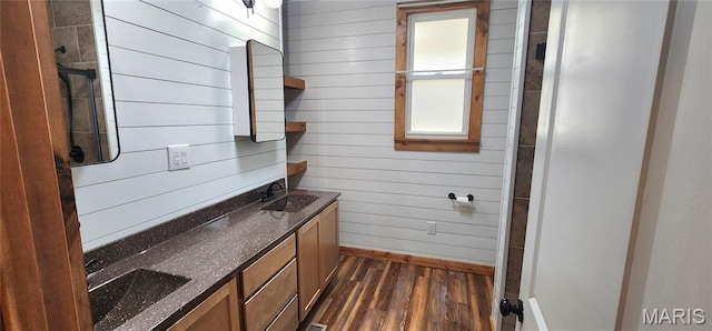 1629 Swanwick St, Chester, IL 62233 - bathroom with wood finished floors, baseboards, double vanity, and wooden walls