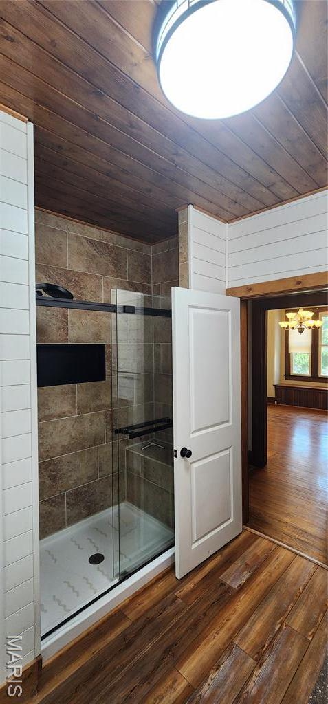 1629 Swanwick St, Chester, IL 62233 - full bathroom featuring a chandelier, wooden ceiling, wood-type flooring, and a stall shower