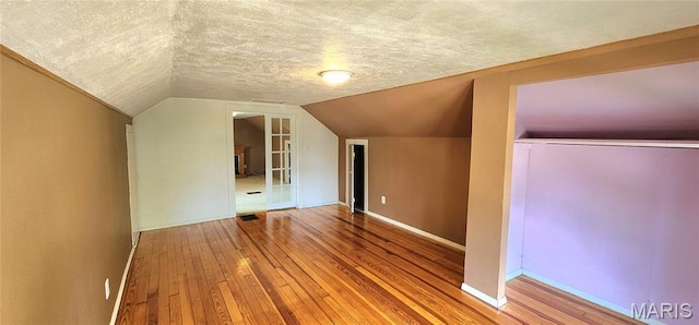 1629 Swanwick St, Chester, IL 62233 - bonus room with hardwood / wood-style flooring, a textured ceiling, lofted ceiling, and baseboards