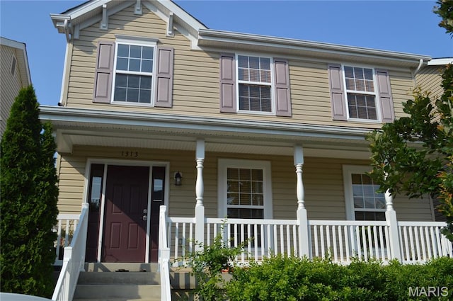 1313 Commons Cir, Cottleville, MO 63304 - view of front of home featuring covered porch
