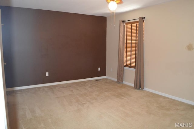 1313 Commons Cir, Cottleville, MO 63304 - spare room featuring light carpet and a ceiling fan