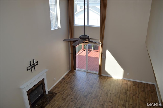 1313 Commons Cir, Cottleville, MO 63304 - unfurnished living room featuring wood finished floors, ceiling fan, and a tile fireplace
