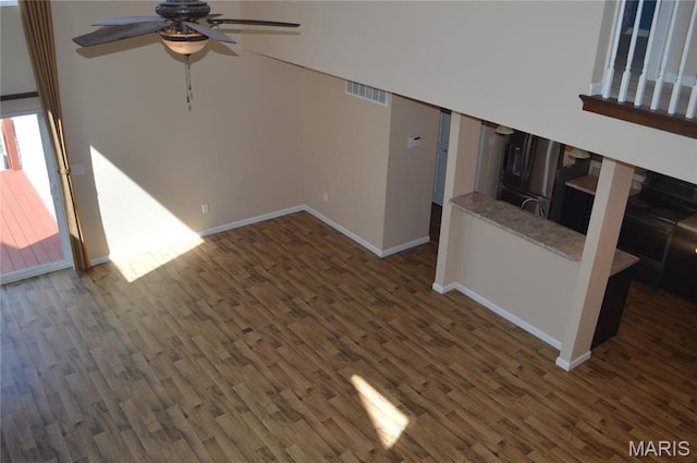 1313 Commons Cir, Cottleville, MO 63304 - unfurnished room featuring a ceiling fan and dark wood finished floors