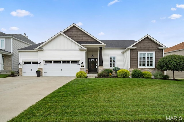 932 Colebrook Ct, Lake St Louis, MO 63367 - view of front of home with stone siding, driveway, a garage, a front yard, and board and batten siding