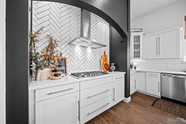 932 Colebrook Ct, Lake St Louis, MO 63367 - kitchen featuring stainless steel appliances, wall chimney exhaust hood, tasteful backsplash, and white cabinets